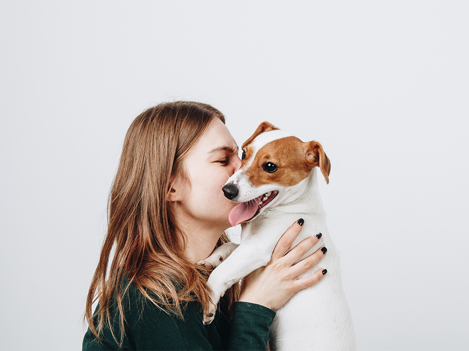 Cute,Young,Woman,Kisses,And,Hugs,Her,Puppy,Jack,Russell